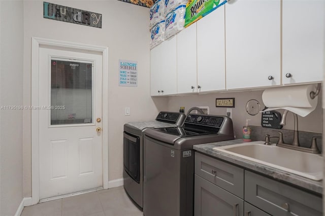 12307 NW 49th St, Coral Springs, FL 33076 - laundry room with washing machine and clothes dryer, cabinet space, baseboards, and light tile patterned flooring