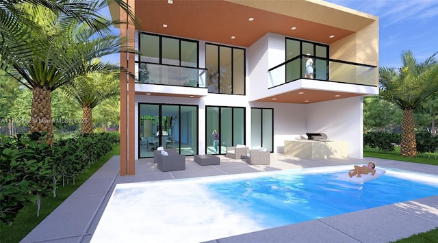 310 NE 2nd St, Boca Raton, FL 33432 - rear view of property featuring stucco siding, a patio area, an outdoor pool, and a balcony