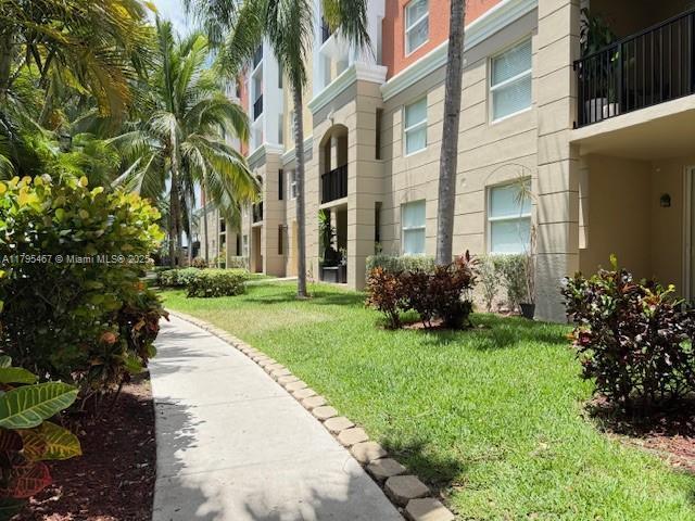 surrounding community with a yard