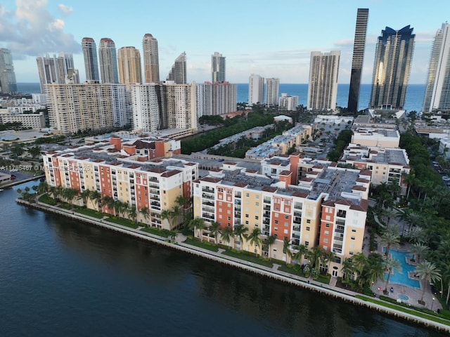 bird's eye view featuring a water view and a city view