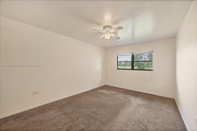26136 Explorer St, Punta Gorda, FL 33983 - empty room with baseboards, ceiling fan, and dark carpet