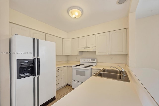 26136 Explorer St, Punta Gorda, FL 33983 - kitchen featuring a sink, white cabinets, under cabinet range hood, white appliances, and light tile patterned flooring