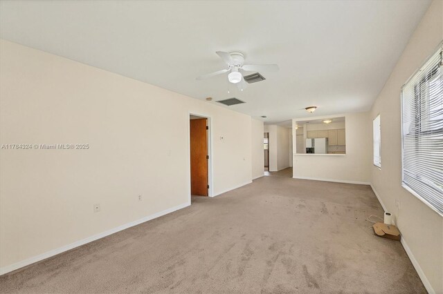 26136 Explorer St, Punta Gorda, FL 33983 - unfurnished room with light colored carpet, a ceiling fan, baseboards, and visible vents