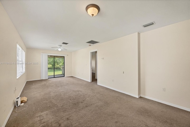 26136 Explorer St, Punta Gorda, FL 33983 - unfurnished room with visible vents, a ceiling fan, and carpet flooring