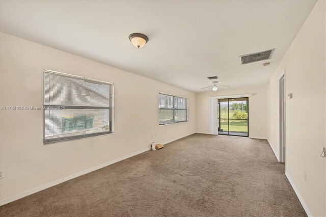 26136 Explorer St, Punta Gorda, FL 33983 - carpeted empty room featuring ceiling fan, visible vents, and baseboards