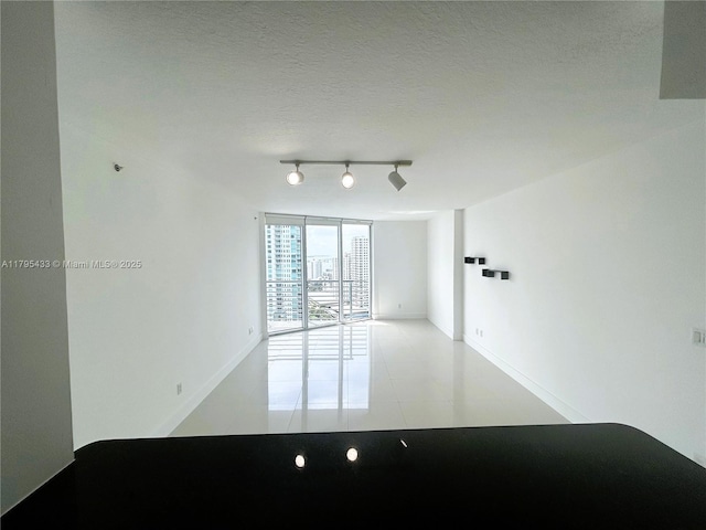 325 S Biscayne Blvd Unit 2917, Miami, FL 33131 - unfurnished room with track lighting and tile patterned flooring