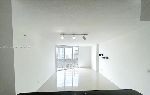 325 S Biscayne Blvd Unit 2917, Miami, FL 33131 - tiled spare room with track lighting and baseboards