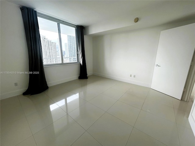 325 S Biscayne Blvd Unit 2917, Miami, FL 33131 - unfurnished room featuring a smoke detector and light tile patterned flooring