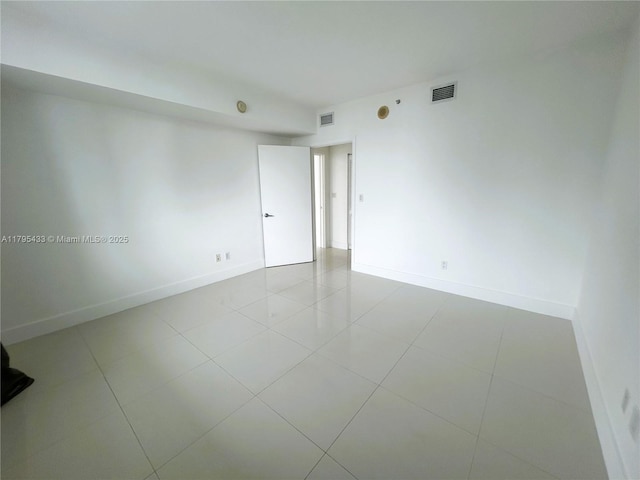 325 S Biscayne Blvd Unit 2917, Miami, FL 33131 - empty room with baseboards and tile patterned flooring
