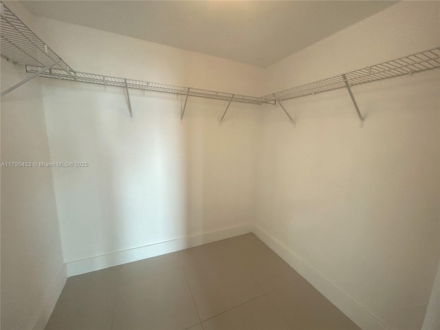 325 S Biscayne Blvd Unit 2917, Miami, FL 33131 - spacious closet featuring tile patterned floors