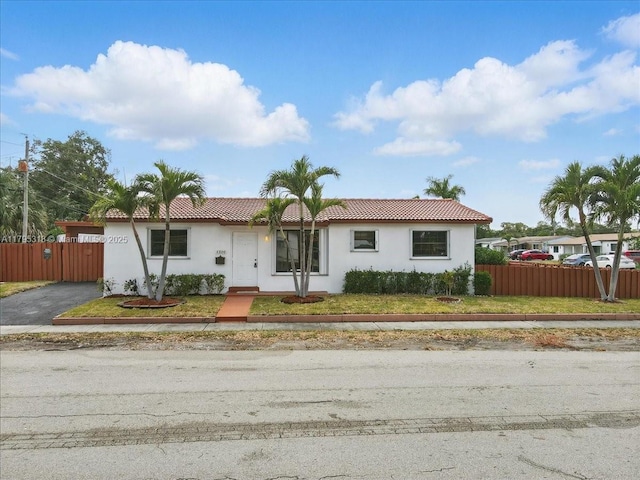 6800 Hope St, Hollywood, FL 33024 - ranch-style house featuring fence, stucco siding, and a tiled roof
