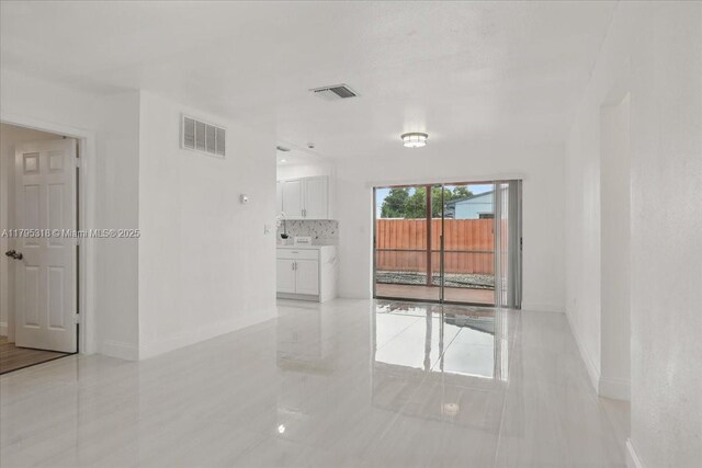 6800 Hope St, Hollywood, FL 33024 - unfurnished room with baseboards, light tile patterned floors, and visible vents