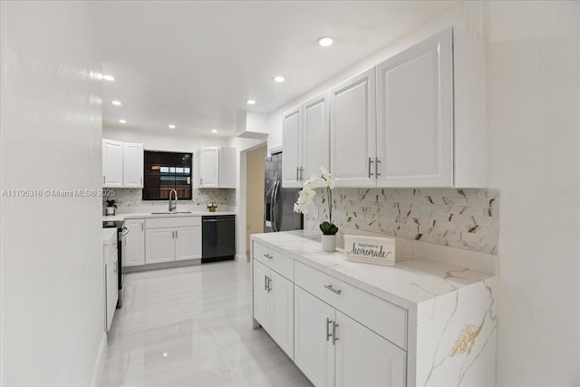 6800 Hope St, Hollywood, FL 33024 - kitchen with recessed lighting, white cabinetry, a sink, backsplash, and stainless steel appliances