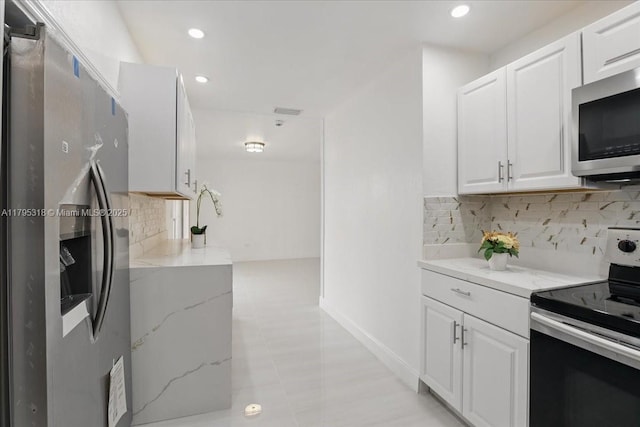 6800 Hope St, Hollywood, FL 33024 - kitchen featuring stainless steel appliances, light stone countertops, and recessed lighting