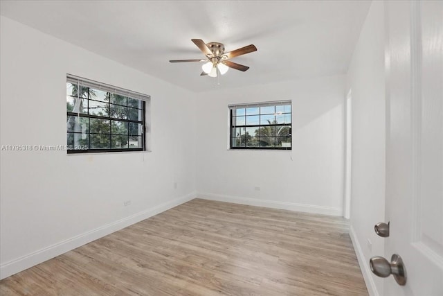 6800 Hope St, Hollywood, FL 33024 - unfurnished room featuring ceiling fan, baseboards, and light wood-style floors
