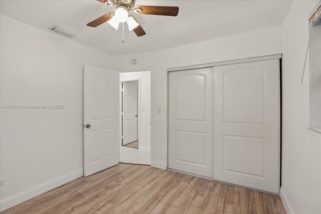 6800 Hope St, Hollywood, FL 33024 - unfurnished bedroom with visible vents, light wood-style floors, baseboards, and a closet