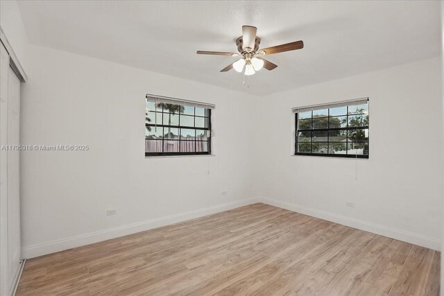 6800 Hope St, Hollywood, FL 33024 - spare room featuring ceiling fan, baseboards, and light wood finished floors
