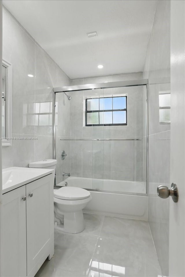 6800 Hope St, Hollywood, FL 33024 - full bathroom featuring marble finish floor, toilet, bath / shower combo with glass door, and vanity