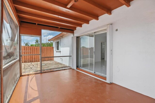 6800 Hope St, Hollywood, FL 33024 - unfurnished sunroom with beam ceiling