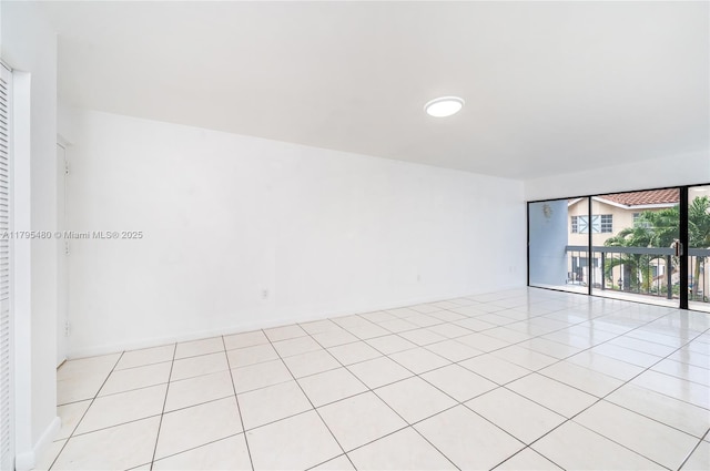 empty room with light tile patterned flooring