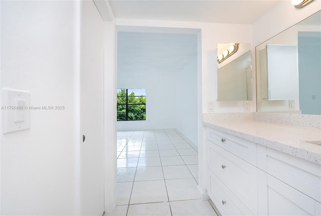 bathroom with tile patterned floors and vanity