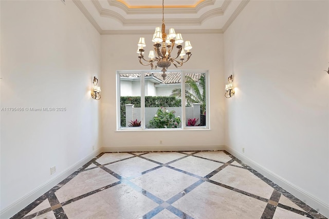 empty room featuring inlaid floor details, a chandelier, a tray ceiling, crown molding, and a high ceiling