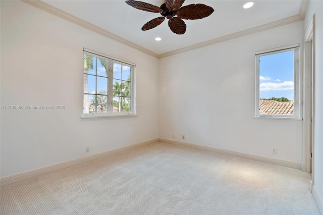 spare room with carpet floors, ceiling fan, ornamental molding, recessed lighting, and baseboards