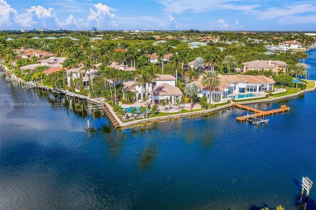 aerial perspective of suburban area with a nearby body of water