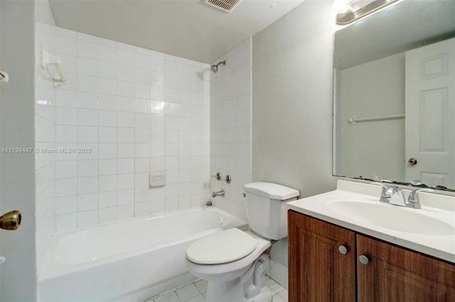 full bath featuring visible vents, baseboards, vanity, toilet, and washtub / shower combination