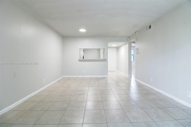 spare room with visible vents, recessed lighting, baseboards, and light tile patterned floors