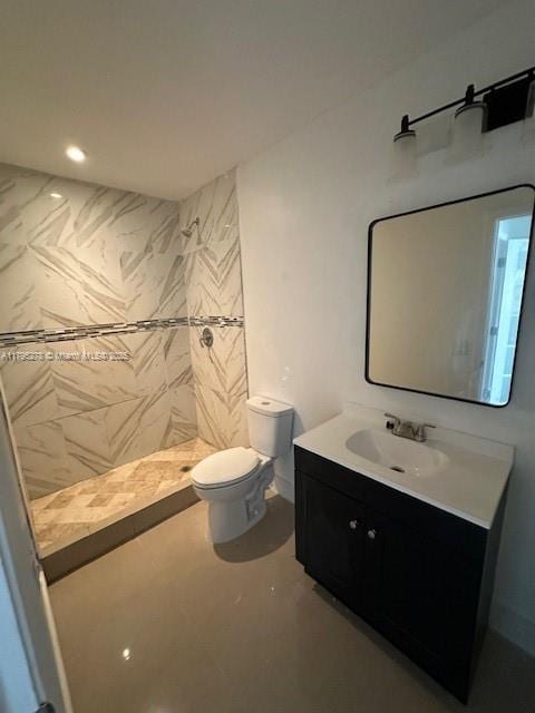 5209 NW 18th St Unit 3E, Lauderhill, FL 33313 - bathroom featuring toilet, recessed lighting, a tile shower, and vanity