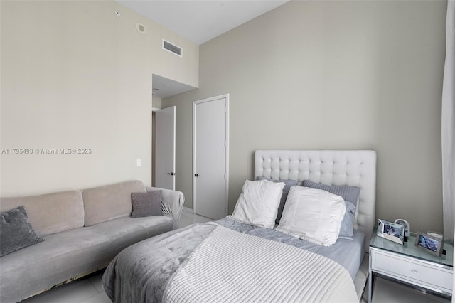 bedroom with visible vents and lofted ceiling