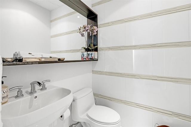 bathroom featuring toilet and a sink