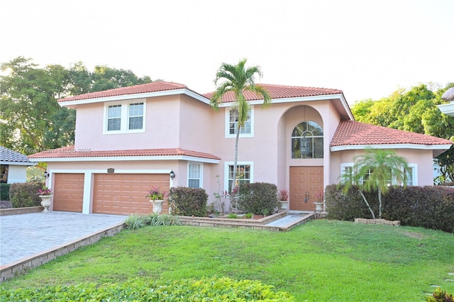 6777 NW 44th Ct, Coral Springs, FL 33067 - view of front facade featuring a front yard, stucco siding, an attached garage, and driveway