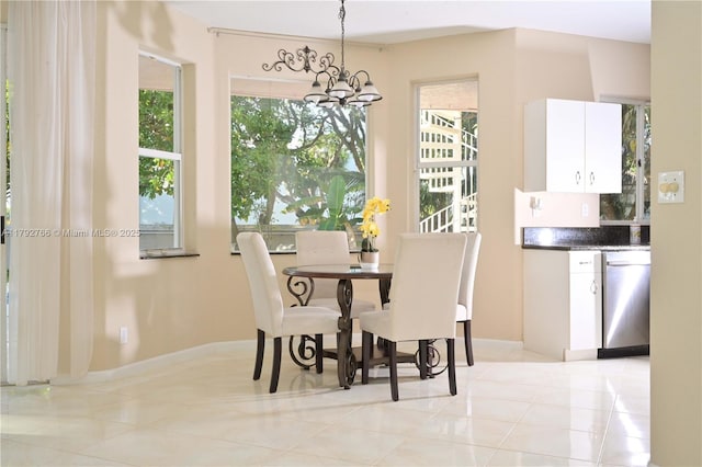 6777 NW 44th Ct, Coral Springs, FL 33067 - dining room with an inviting chandelier, baseboards, light tile patterned floors, and a healthy amount of sunlight