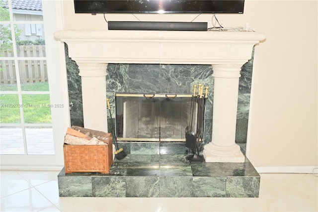 6777 NW 44th Ct, Coral Springs, FL 33067 - room details featuring a tile fireplace and baseboards
