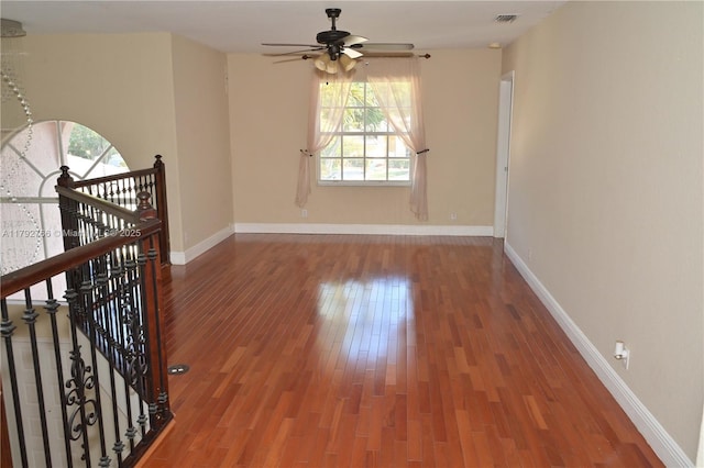 6777 NW 44th Ct, Coral Springs, FL 33067 - empty room with ceiling fan, a healthy amount of sunlight, visible vents, and wood finished floors