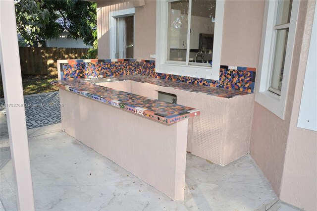 6777 NW 44th Ct, Coral Springs, FL 33067 - view of patio / terrace with fence
