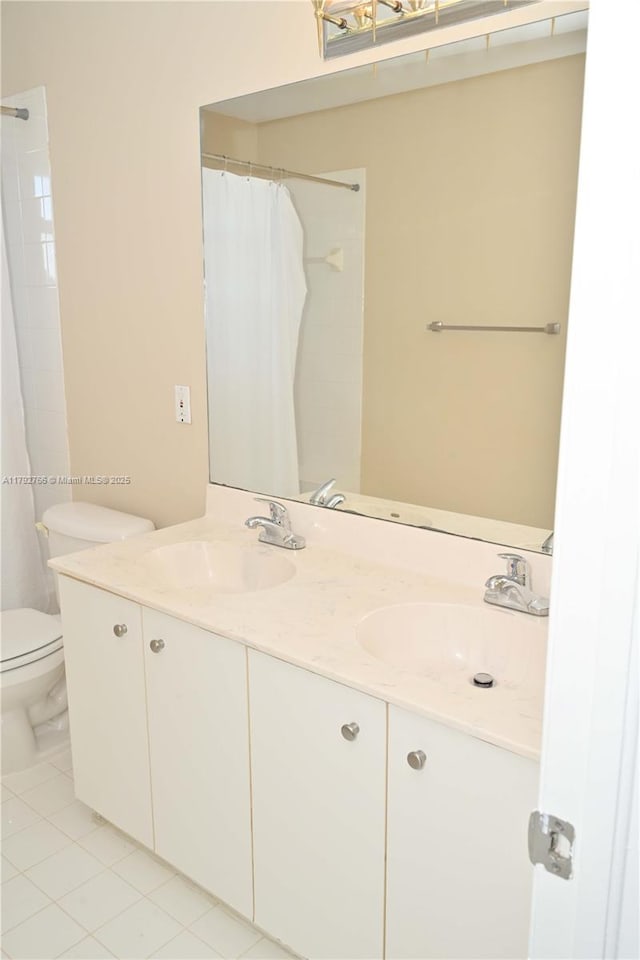 6777 NW 44th Ct, Coral Springs, FL 33067 - bathroom featuring double vanity, toilet, tile patterned flooring, and a sink