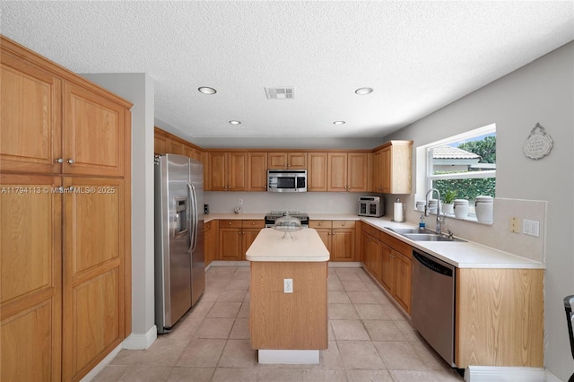 2093 NW 208th Ter, Pembroke Pines, FL 33029 - kitchen with visible vents, a center island, light countertops, a sink, and stainless steel appliances