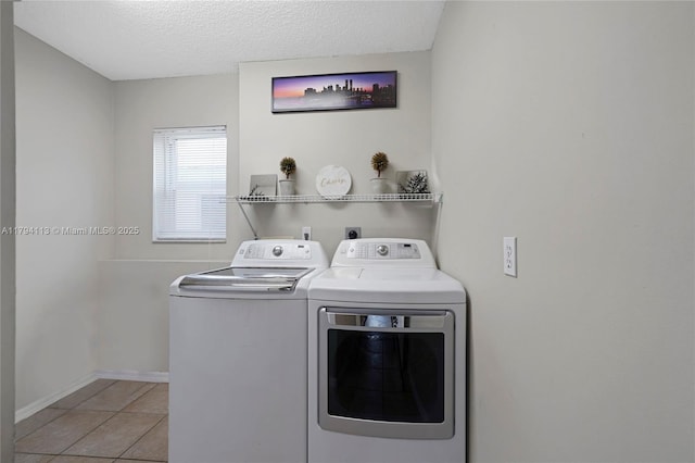 2093 NW 208th Ter, Pembroke Pines, FL 33029 - laundry room featuring laundry area, a textured ceiling, baseboards, separate washer and dryer, and light tile patterned flooring