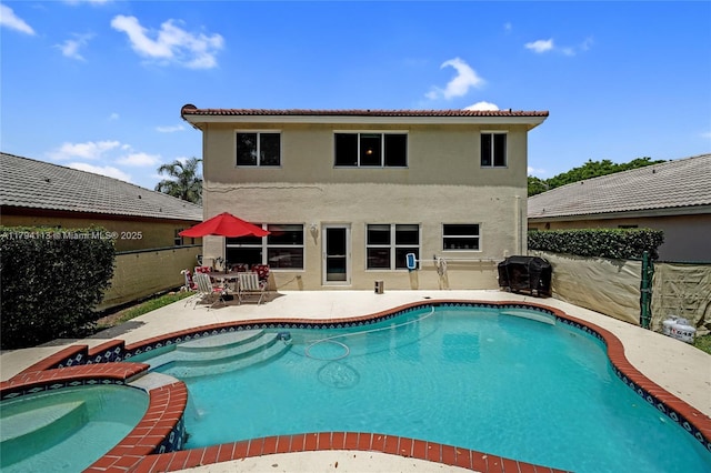 2093 NW 208th Ter, Pembroke Pines, FL 33029 - view of pool featuring a fenced backyard, a patio, a pool with connected hot tub, and area for grilling