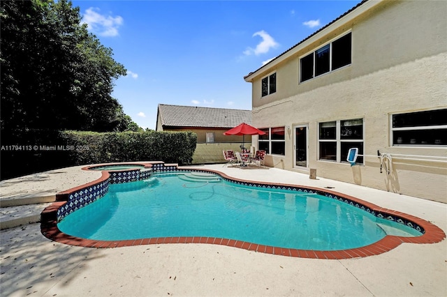 2093 NW 208th Ter, Pembroke Pines, FL 33029 - view of swimming pool featuring a pool with connected hot tub and a patio area