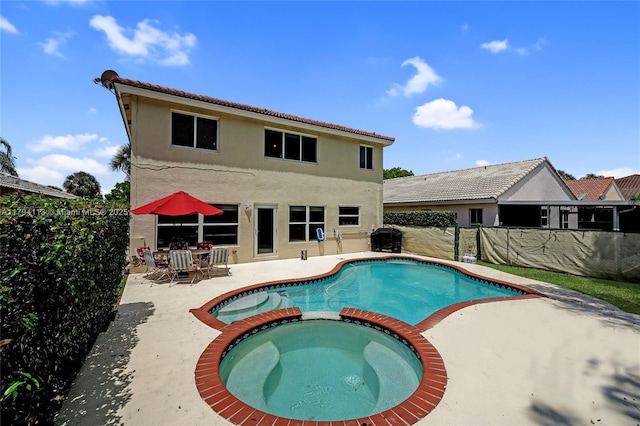2093 NW 208th Ter, Pembroke Pines, FL 33029 - view of swimming pool with a patio, a pool with connected hot tub, and a fenced backyard