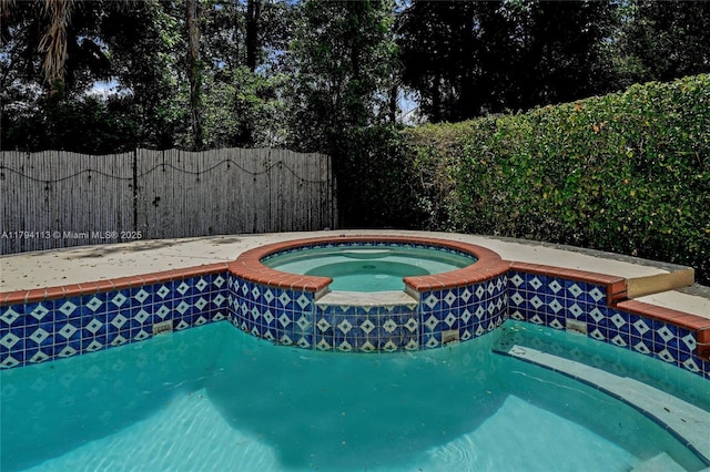 2093 NW 208th Ter, Pembroke Pines, FL 33029 - view of pool with a fenced in pool, an in ground hot tub, and fence