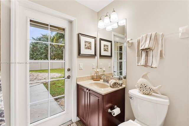 bathroom featuring vanity and toilet