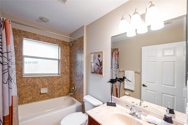 full bath featuring vanity, toilet, a textured ceiling, and shower / bath combo with shower curtain