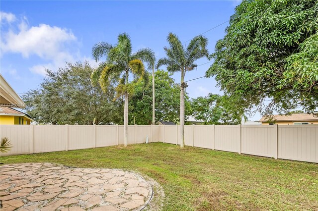 view of yard with a fenced backyard and a patio area