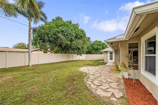 view of yard with fence and a patio area