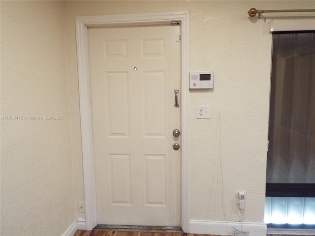 view of exterior entry with stucco siding